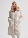 cream sherpa coat with high neck, 2 large patch pockets and drawstring waist