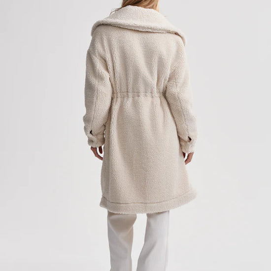 cream sherpa coat with high neck, 2 large patch pockets and drawstring waist rear view 