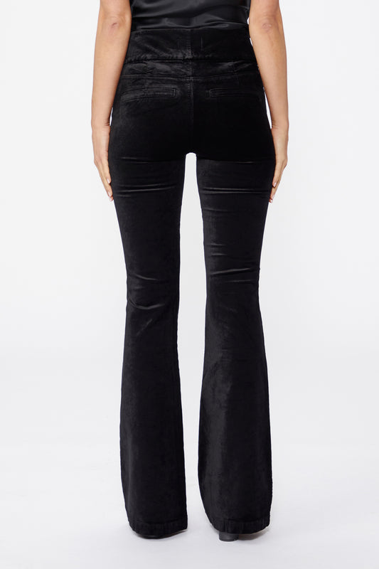 rear view of trousers cut in dark navy velvet with stretch