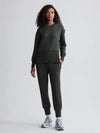 dark green sweater with round neck and zip detail model shot