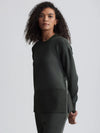 dark green sweater with round neck and zip detail side view 