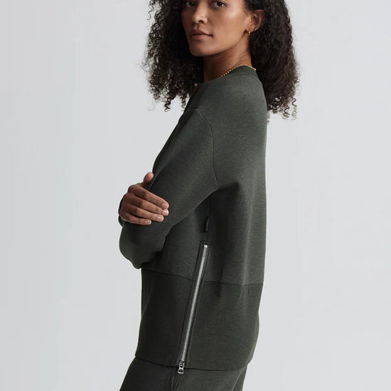 dark green sweater with round neck and zip detail side view 