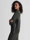 dark green sweater with round neck and zip detail side view 