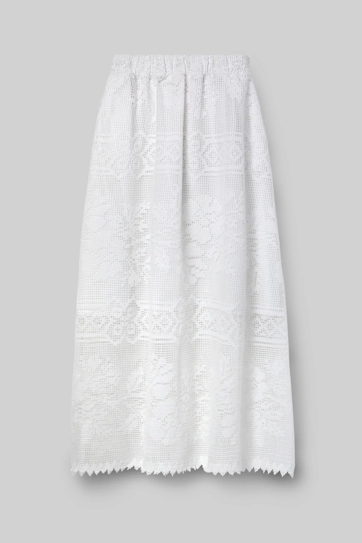 White lace skirt by Beaumonet Organic on a gray background