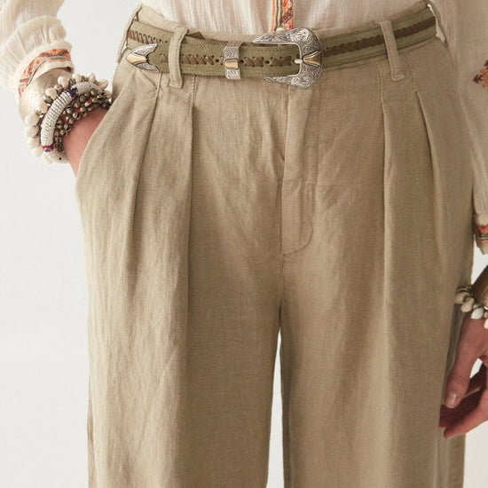 Light khaki wide leg linen trousers with pleated front zip fly and button fastening