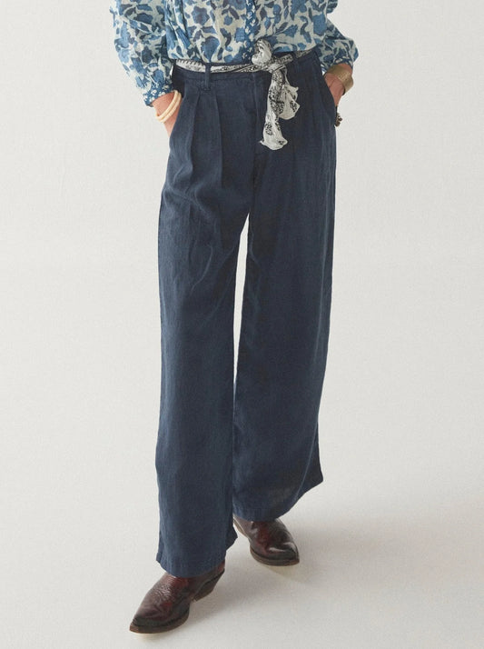 Navy wide leg linen trousers with pleated front zip fly and button fastening