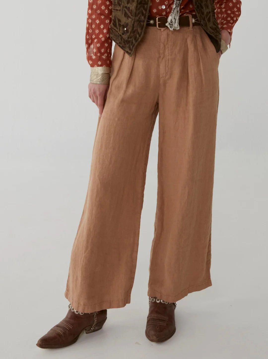 Light brown wide leg linen trousers with pleated front zip fly and button fastening