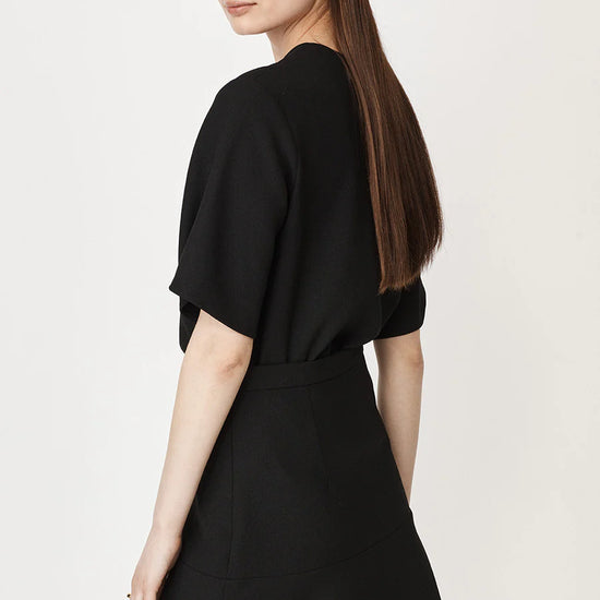 Black short fluted sleeved shell top with back zip fastening