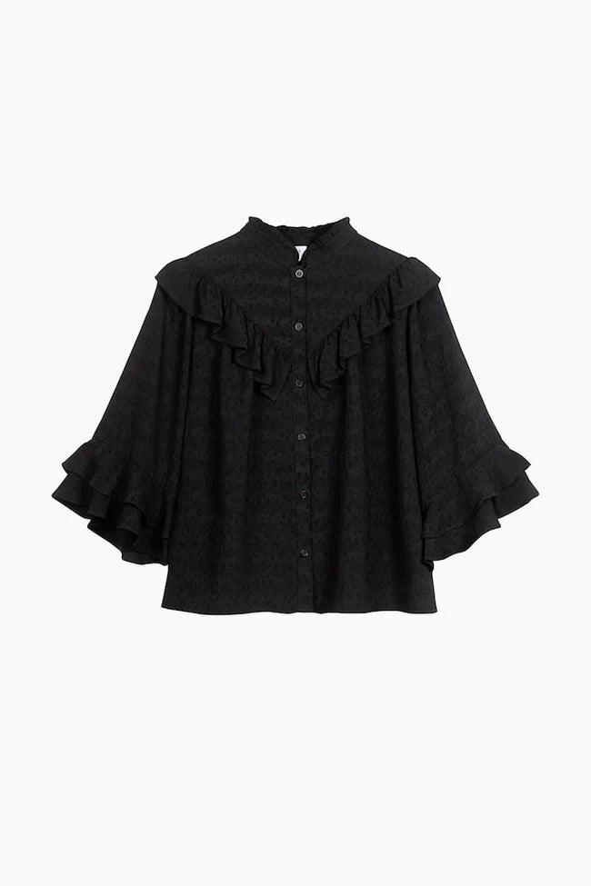 Black ruffle blouse with high ruffle collar, V shaped ruffle on the yoke and three quarter length sleeves with ruffle details