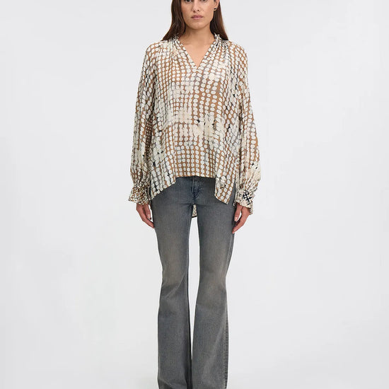 silk blouse with irregular polka dot print with raglan sleeves, v neck and elasticated cuffs model shot