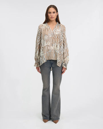 silk blouse with irregular polka dot print with raglan sleeves, v neck and elasticated cuffs model shot