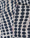 silk scarf with black polka dots close up