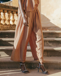 Wide leg silk trousers in brown and caramel stripes with an elasticated waist