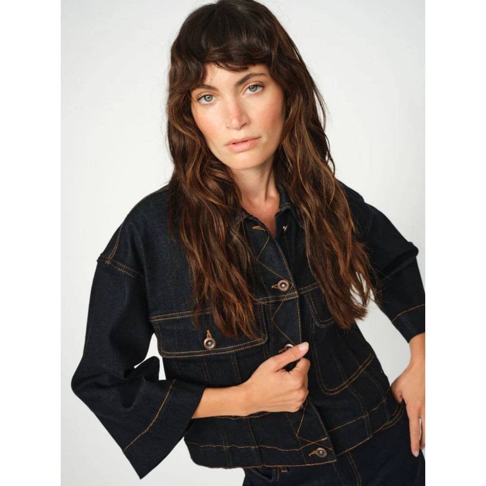 dark blue boxy denim jacket with 2 large buttoned pockets  model shot