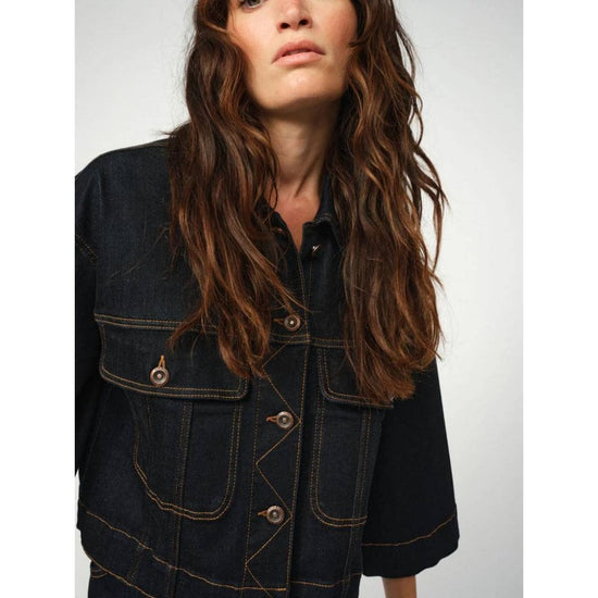 dark blue boxy denim jacket with 2 large buttoned pockets  model shot