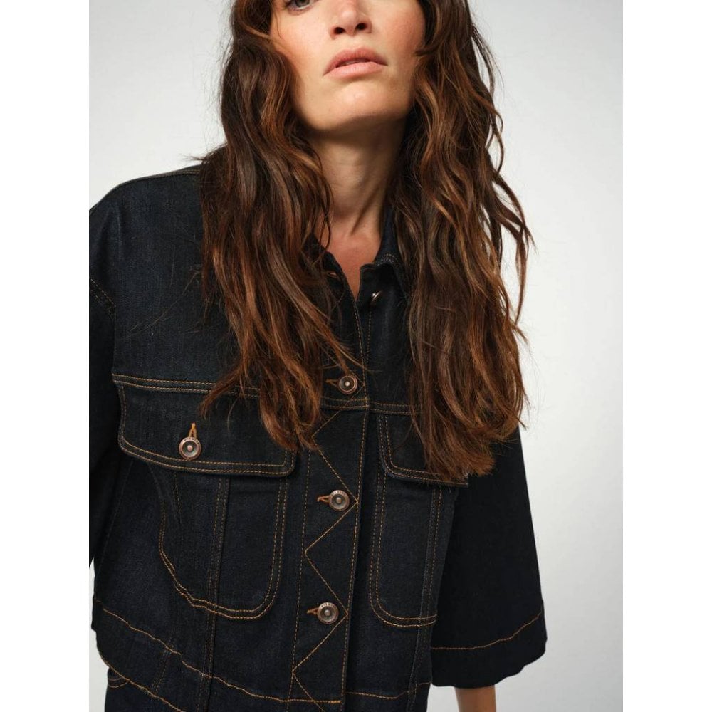 dark blue boxy denim jacket with 2 large buttoned pockets  model shot