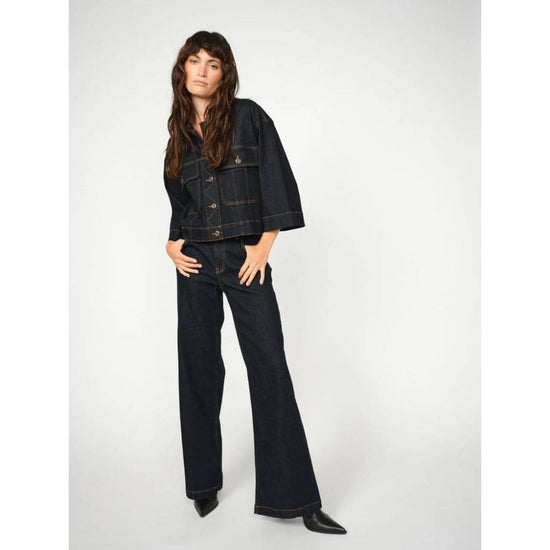 dark blue boxy denim jacket with 2 large buttoned pockets model shot