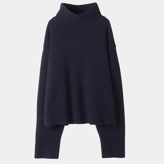 Navy blue sweater on a light gray background