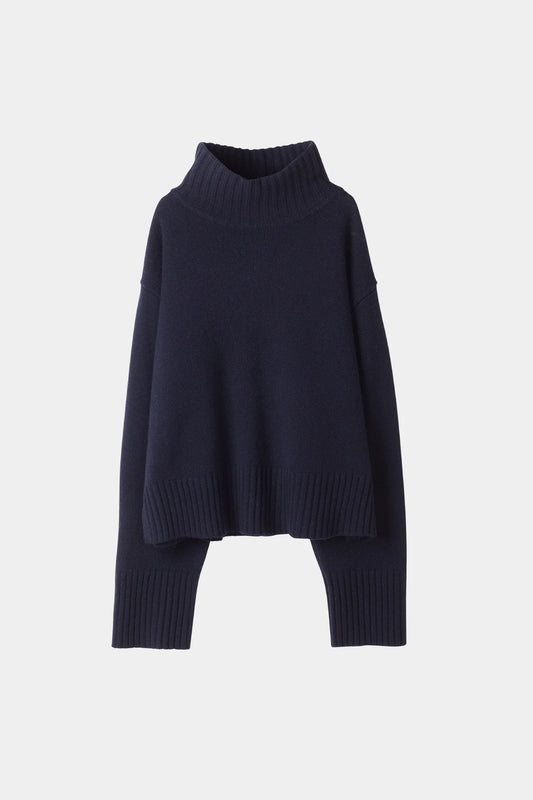 Navy blue sweater on a light gray background