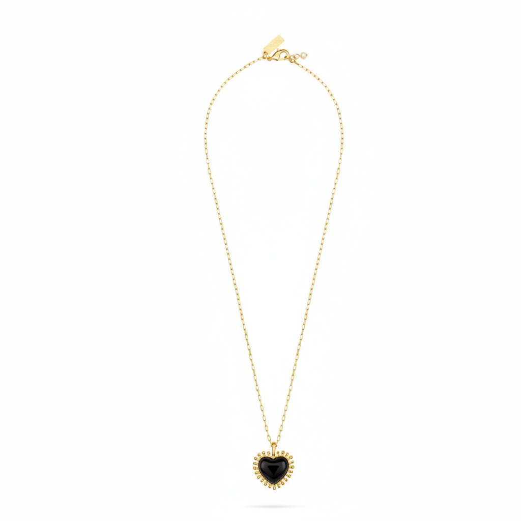 black agate heart shaped pendant with gold spike edging on a gold chain from talis chains full view 