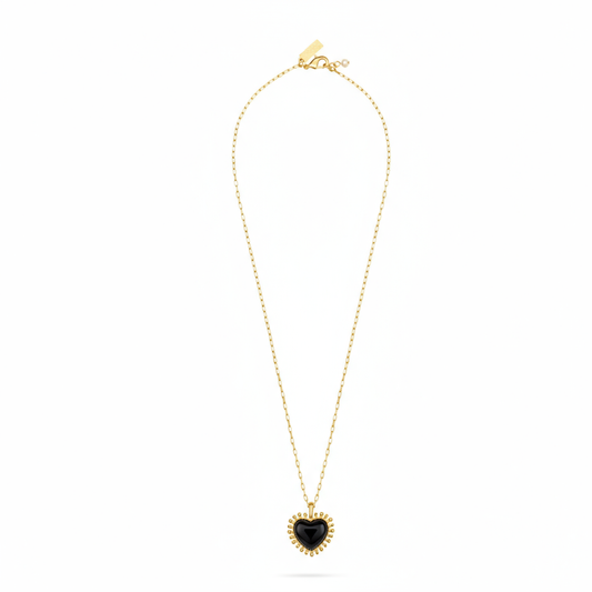 black agate heart shaped pendant with gold spike edging on a gold chain from talis chains full view 