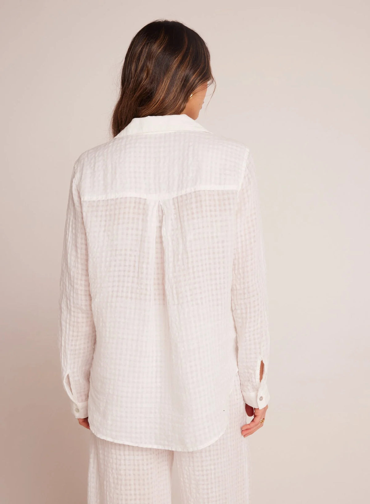 Rear view of white linen and cotton blend shirt with long sleeves and single chest pocket