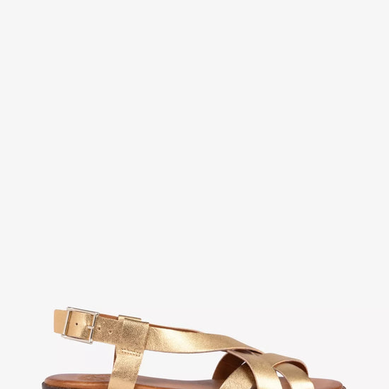 Gold sandal on a white background