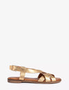 Gold sandal on a white background