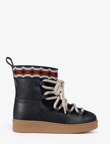 blue short boot with thick soles and cream laces