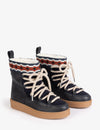 two blue short boot with thick soles and cream laces