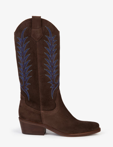 Brown cowboy boot with blue embroidery on white background