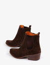 Pair of brown suede ankle boots with orange lining on a white background