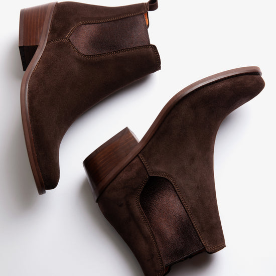 Brown suede ankle boot on a white background