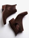 Brown suede ankle boot on a white background