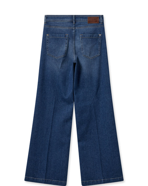 Mid wash straight leg mid-high rise blue jeans with silver buttong zip fly and contrast stitching and subtle fading and whiskering