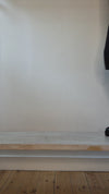 Model wearing black leather chunky boot with buckles shown at different angles. 
