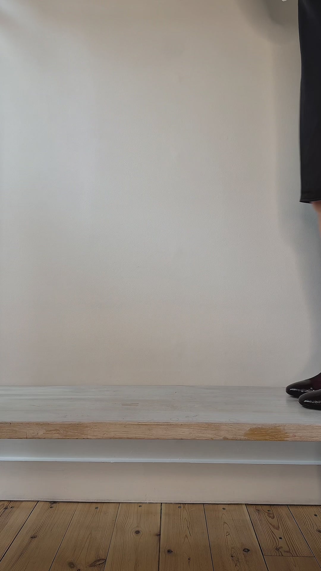 Model wearing burgundy suede round toe boots shown at different angles. 