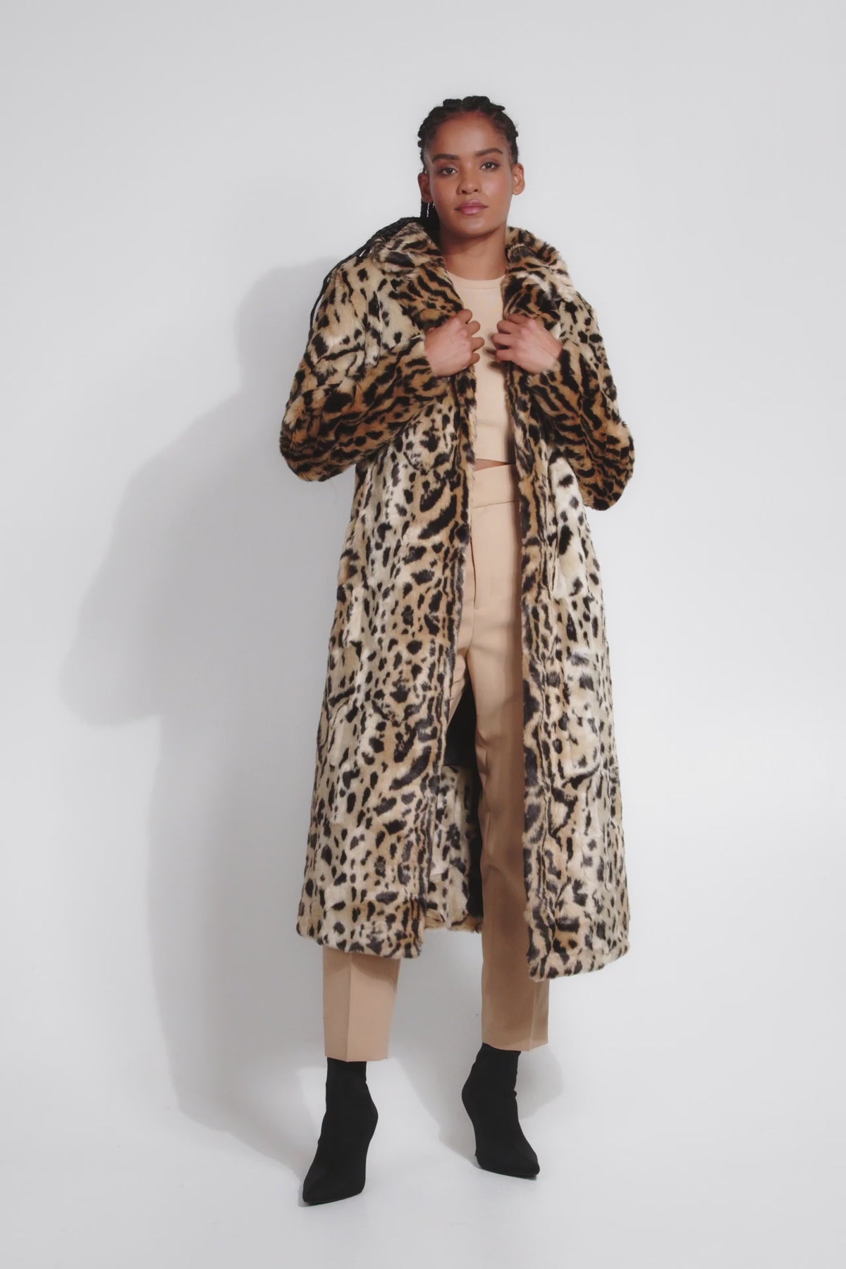 model in a video showcasing a faux fur coat