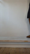 Model wearing tan suede western style boot shown at different angles. 