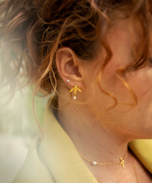 Gold flying bee stud earrings with butterfly fastening and teardrop pearl