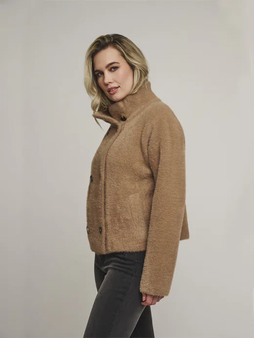 tan double breasted cardigan with stand up collar and side pockets side view 