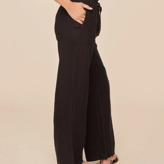 Side view of black wide leg trousers