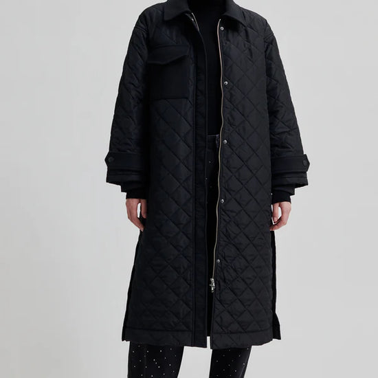 diamond stitch black coat with cool 
collar, chest pocket and straps on cuffs 