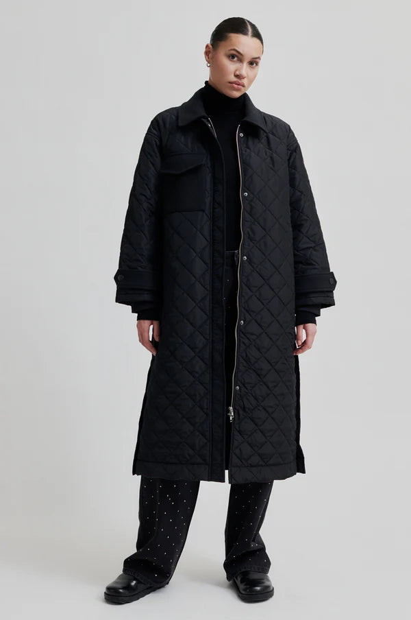 diamond stitch black coat with cool 
collar, chest pocket and straps on cuffs 