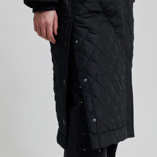 diamond stitch black coat with cool 
collar, chest pocket and straps on cuffs  close up