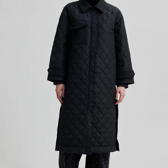 diamond stitch black coat with cool 
collar, chest pocket and straps on cuffs 