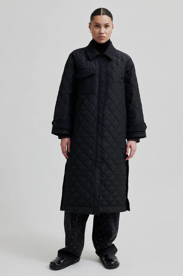 diamond stitch black coat with cool 
collar, chest pocket and straps on cuffs 