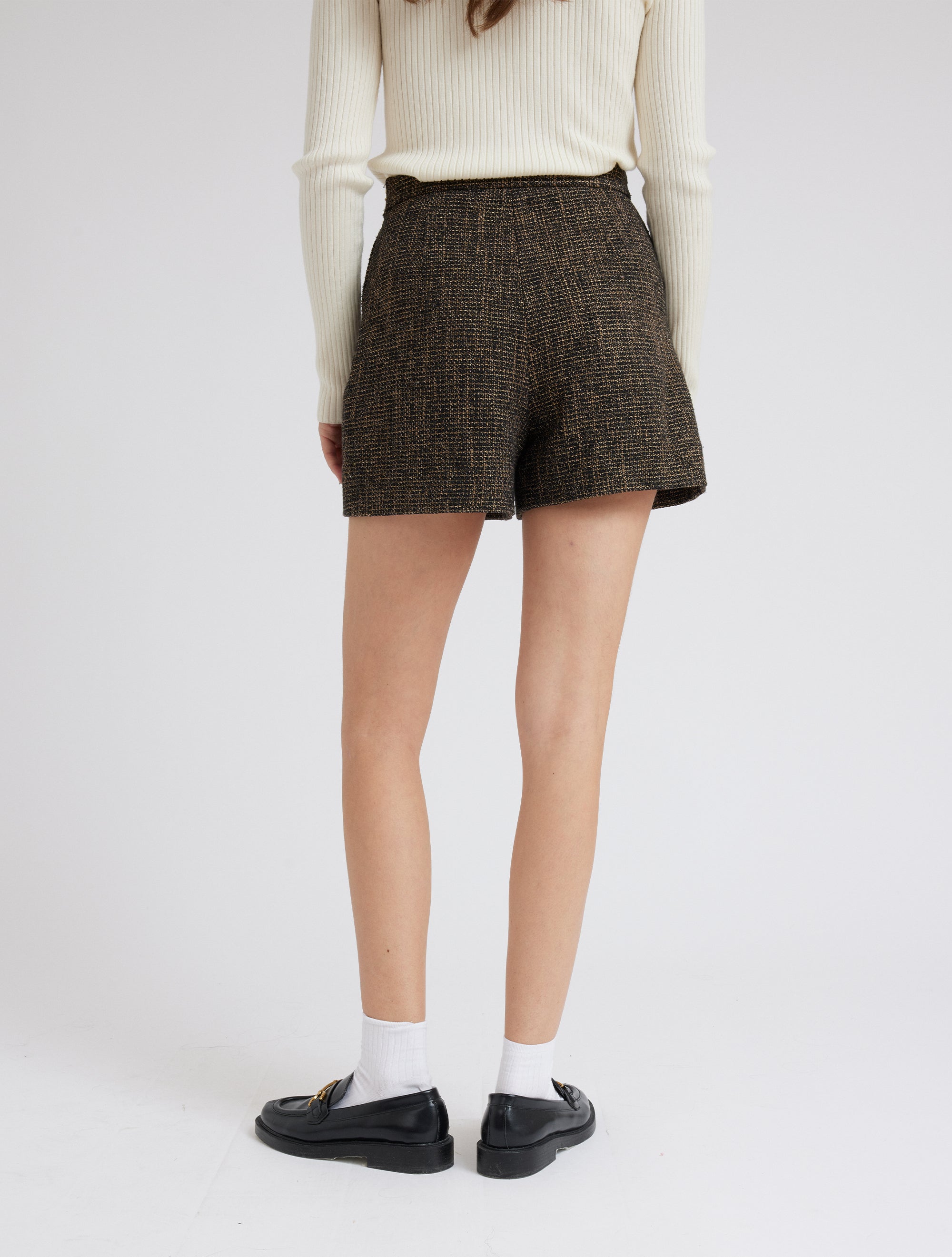 Black, taupe and gold thread boucle shorts with two feature buttons and slant side pockets