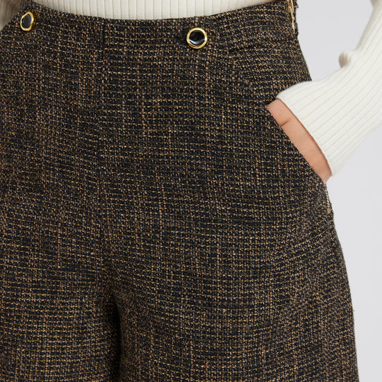 Black, taupe and gold thread boucle shorts with two feature buttons and slant side pockets