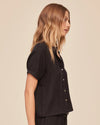 Side view of black short sleeve shirt